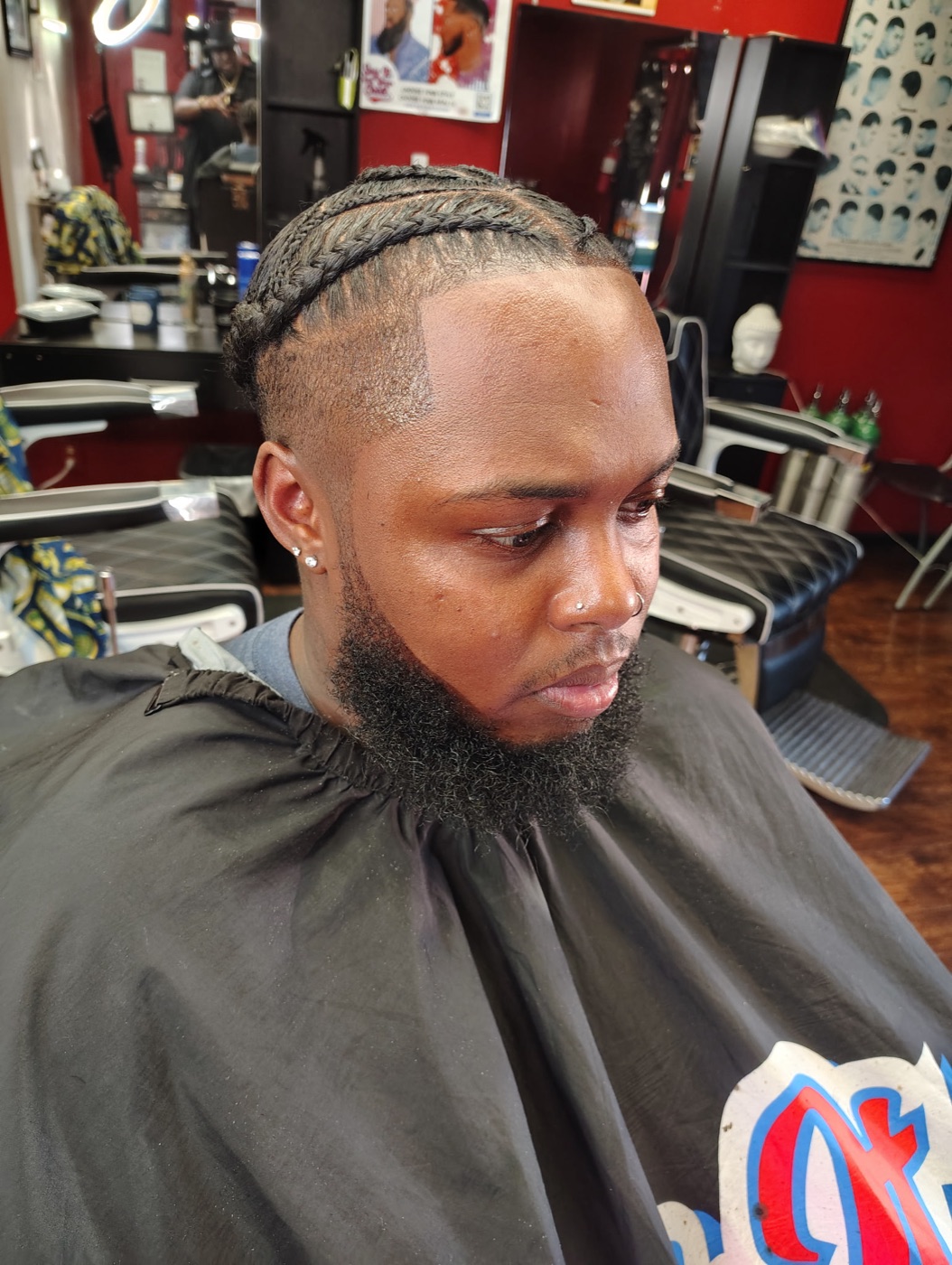 Neat cornrows with a lined-up beard